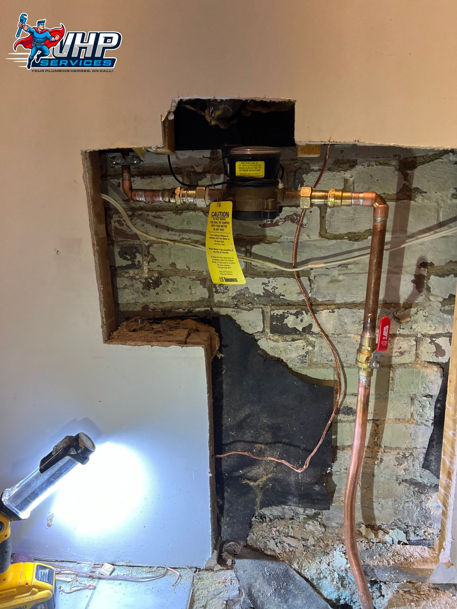 Water line repair in Toronto – technician fixing underground pipe